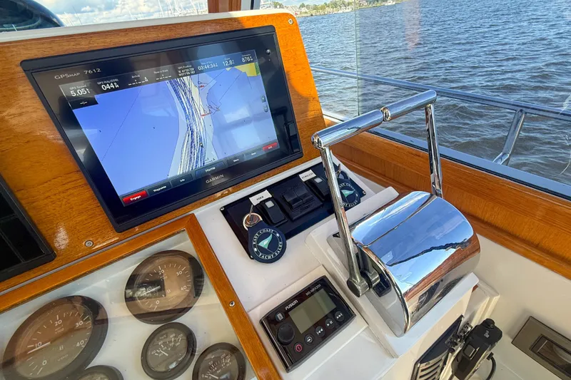 Slide: The Image of Helm of 2003 Grand Banks 38 Eastbay HX with navigation display and controls. - 14
