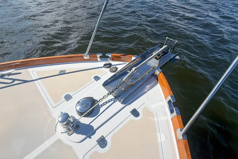 Slide: The Image of Bow of 2003 Grand Banks 38 Eastbay HX yacht with anchor and teak accents. - 41