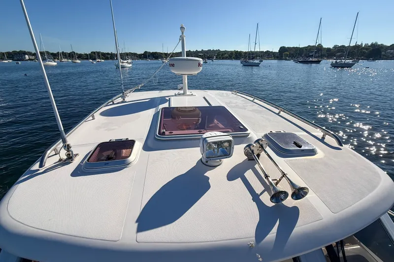 Slide: The Image of 2008 True North 34 boat deck with hatches and radar, anchored in a sunny harbor. - 21