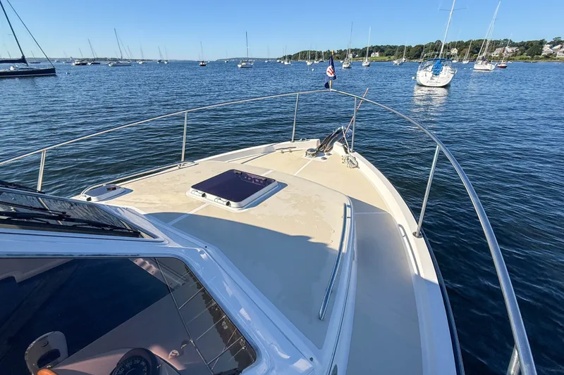 Slide: The Image of Bow view of 2008 True North 34 yacht on calm waters with sailboats nearby. - 18
