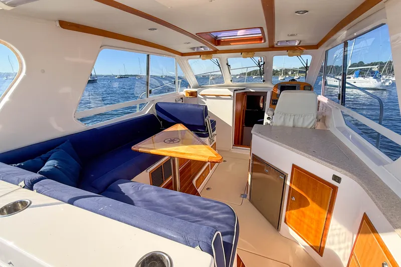 Slide: The Image of Luxurious interior of 2008 True North 34 yacht with blue seating and wooden accents. - 24