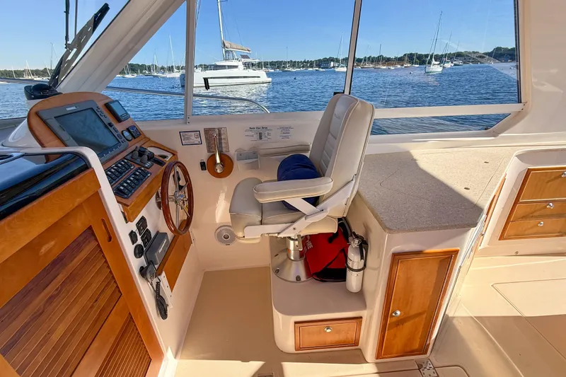 Slide: The Image of Interior helm of 2008 True North 34 boat with steering wheel and navigation equipment. - 11