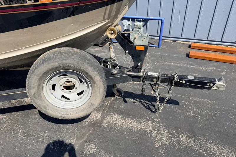Slide: The Image of 2008 G3 Angler V185 FS boat trailer hitch and wheel on asphalt. - 18