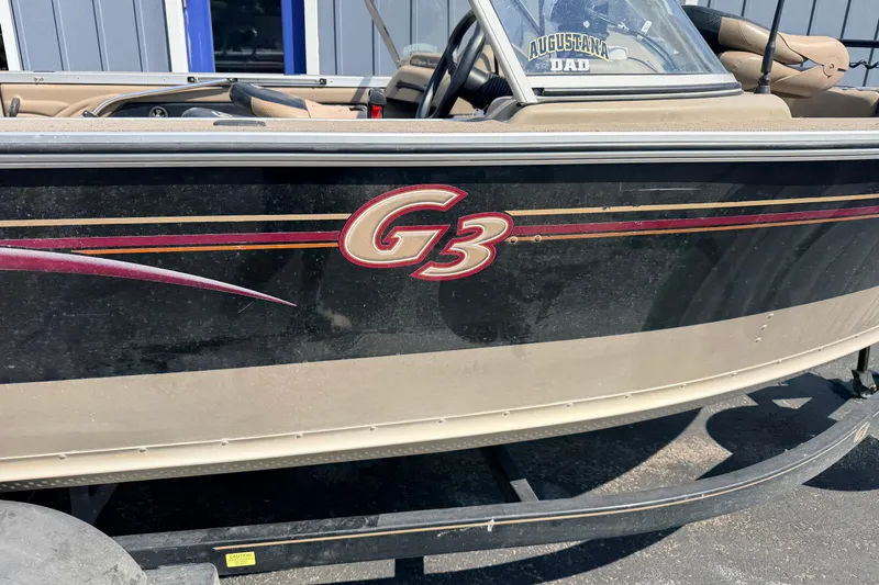 Slide: The Image of 2008 G3 Angler V185 FS boat with logo, parked outdoors. - 17