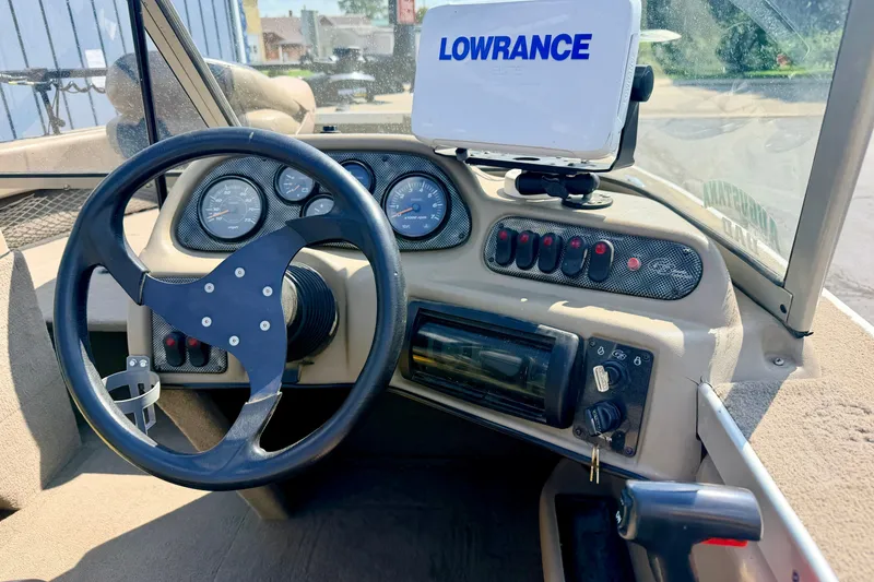 Slide: The Image of 2008 G3 Angler V185 FS boat dashboard with steering wheel and Lowrance GPS system. - 15