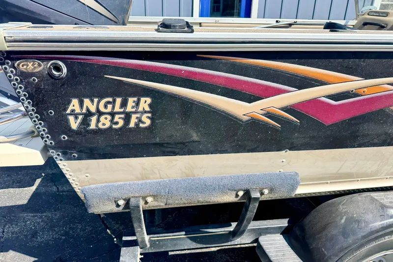 Slide: The Image of 2008 G3 Angler V185 FS boat side view with colorful graphics. - 16