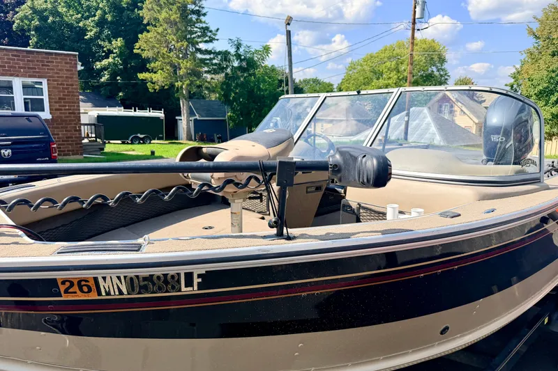 Slide: The Image of 2008 G3 Angler V185 FS boat with windshield, parked outdoors on a sunny day. - 8