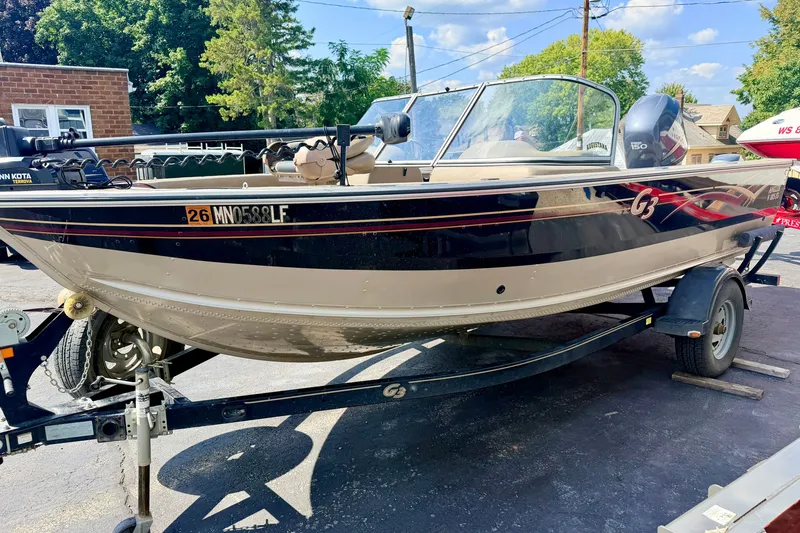 Slide: The Image of 2008 G3 Angler V185 FS boat on trailer, parked outdoors on a sunny day. - 6