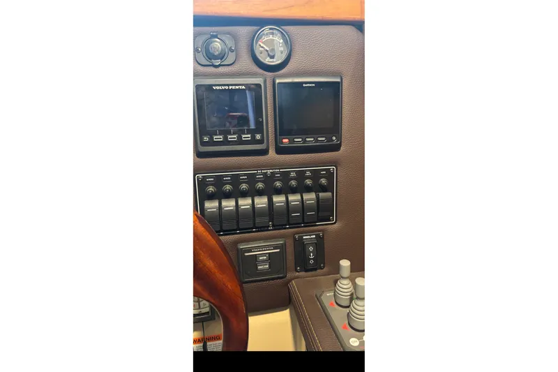 Slide: The Image of Control panel of 2015 Ranger Tugs R-25 SC with Volvo Penta and Garmin displays. - 34