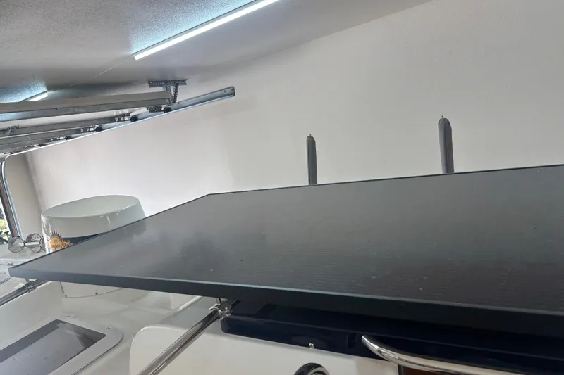 Slide: The Image of Interior view of a 2015 Ranger Tugs R-25 SC boat with modern fixtures. - 17