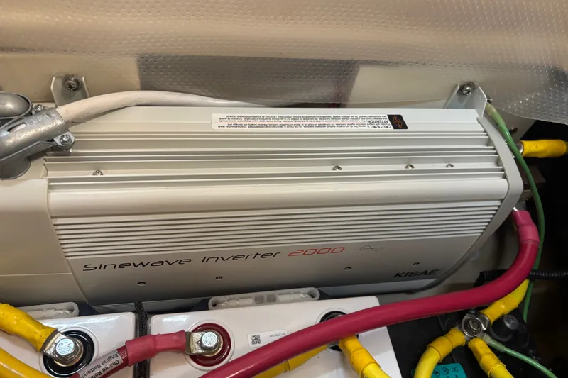 Slide: The Image of Sinewave inverter 2000 in a 2015 Ranger Tugs R-25 SC boat, with connected cables. - 27