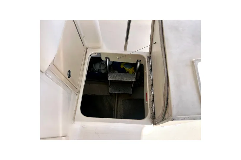 Slide: The Image of Hatch opening on 2008 Mainship 34 Trawler, revealing interior access steps. - 43