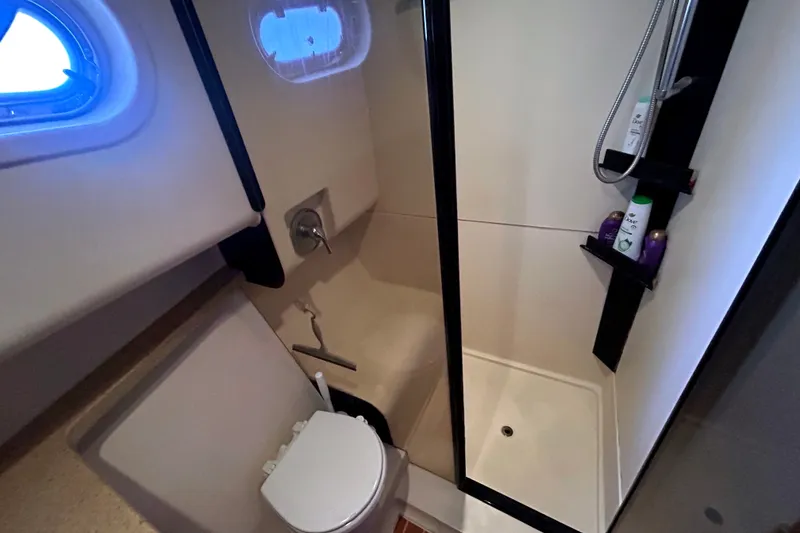 Slide: The Image of Bathroom interior of 2008 Mainship 34 Trawler with shower and toilet. - 20