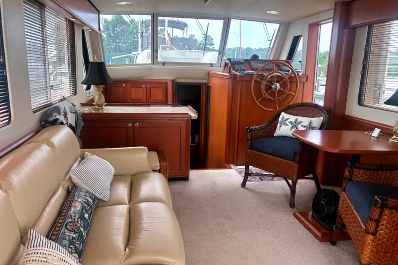 Slide: The Image of Interior of 2008 Mainship 34 Trawler with elegant seating and helm station. - 5