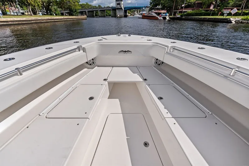 Slide: The Image of 2018 Invincible 42 Center Cabin boat interior with spacious seating and storage compartments. - 31