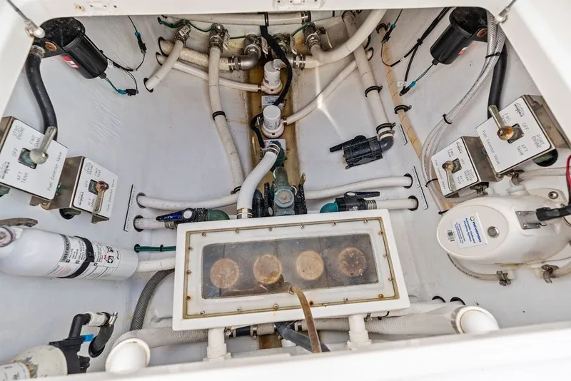 Slide: The Image of Engine compartment of 2018 Invincible 42 Center Cabin with various mechanical components. - 41