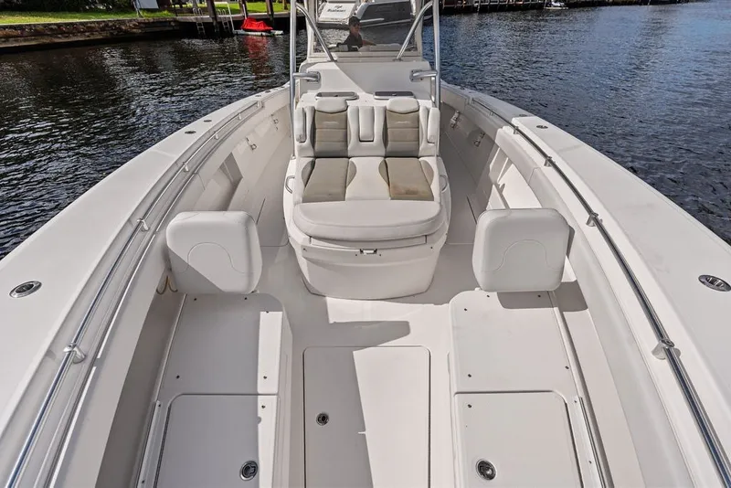 Slide: The Image of 2018 Invincible 42 Center Cabin boat interior with seating and storage compartments. - 30