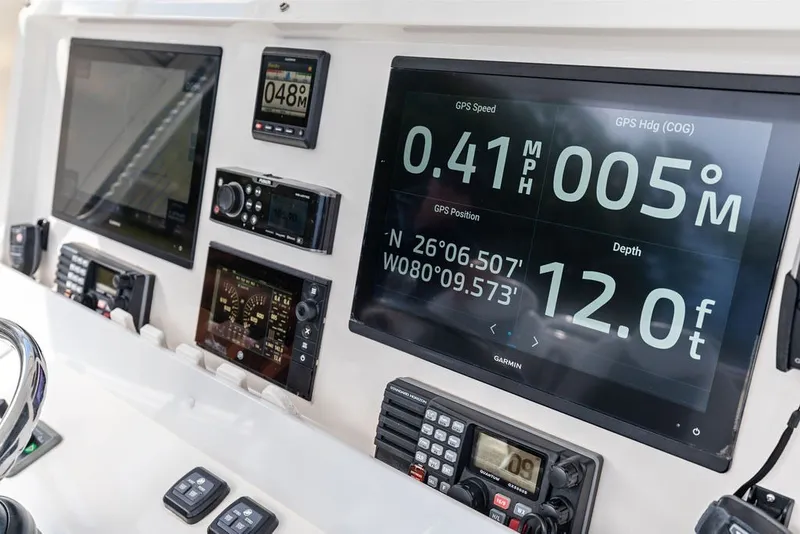 Slide: The Image of Dashboard of 2018 Invincible 42 Center Cabin with GPS and navigation displays. - 27
