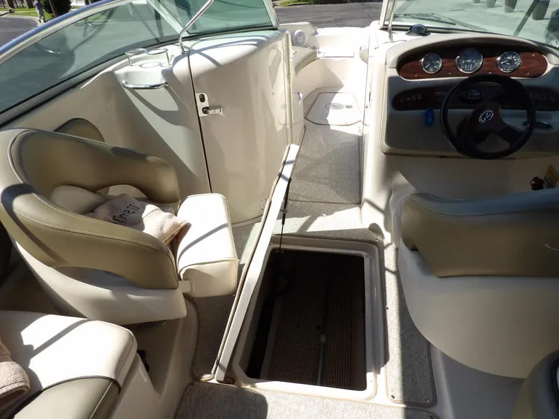 Slide: The Image of Interior of 2005 Sea Ray 240 Sundeck boat with seating and storage. - 22