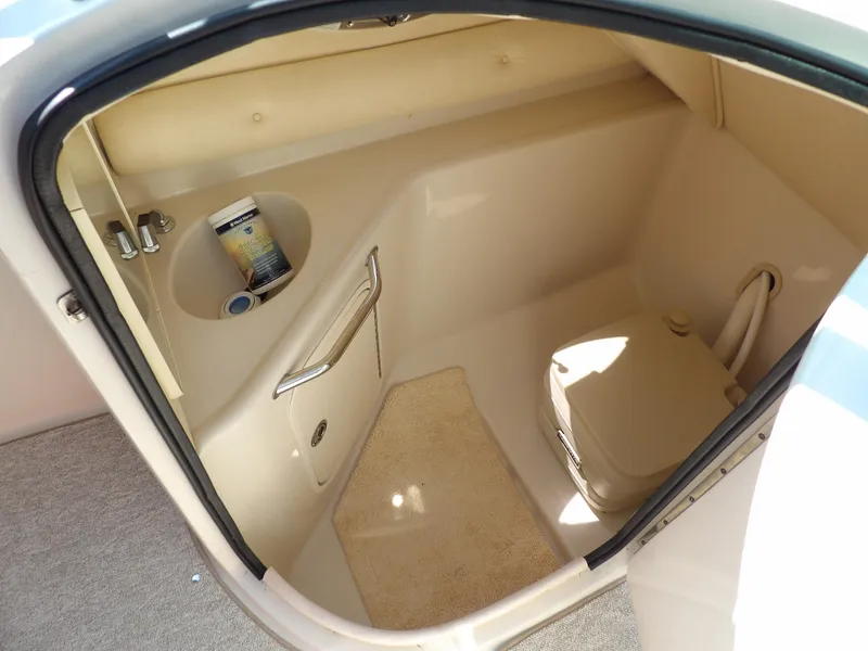 Slide: The Image of 2005 Sea Ray 240 Sundeck boat interior with compact bathroom amenities. - 29