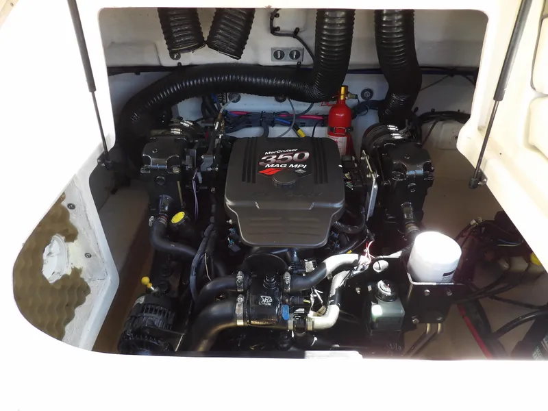 Slide: The Image of Engine compartment of a 2005 Sea Ray 240 Sundeck boat. - 31