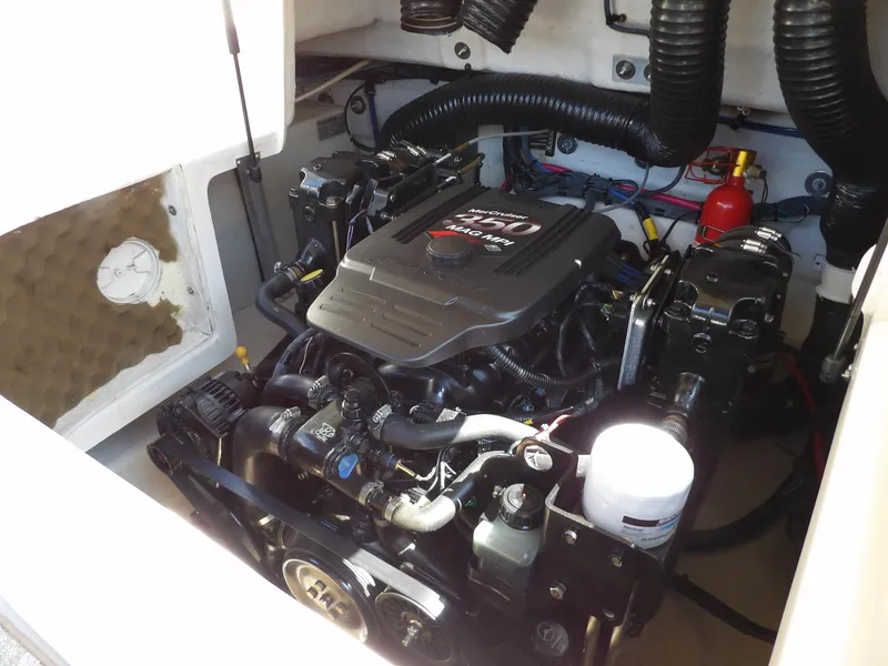 Slide: The Image of Engine compartment of 2005 Sea Ray 240 Sundeck boat, featuring a MerCruiser engine. - 33