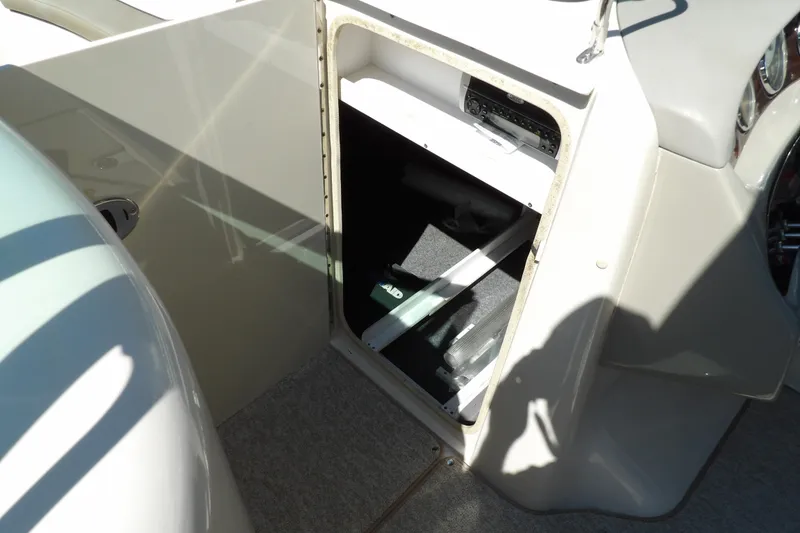 Slide: The Image of Open storage compartment on 2005 Sea Ray 240 Sundeck boat. - 30