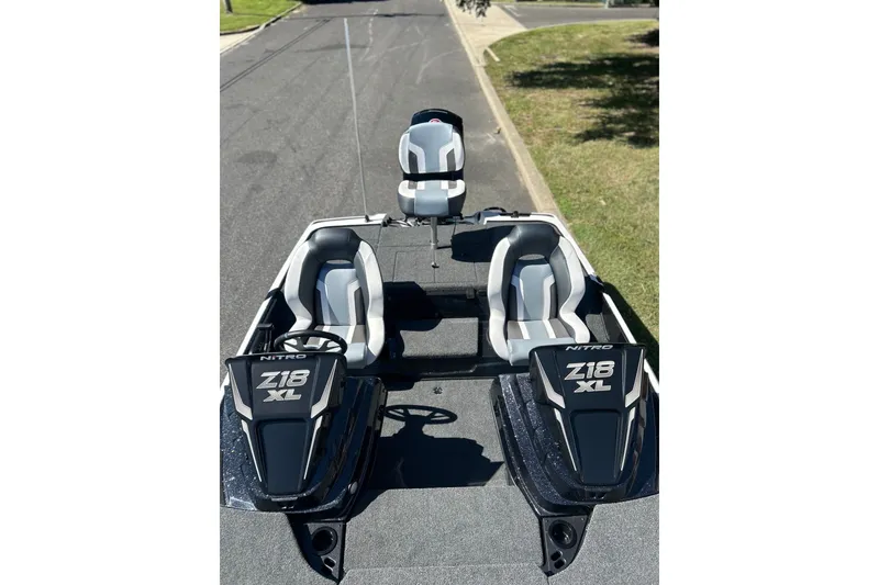 Slide: The Image of 2027 Nitro Z18 XL Pro boat with dual seats and sleek design on a road. - 7