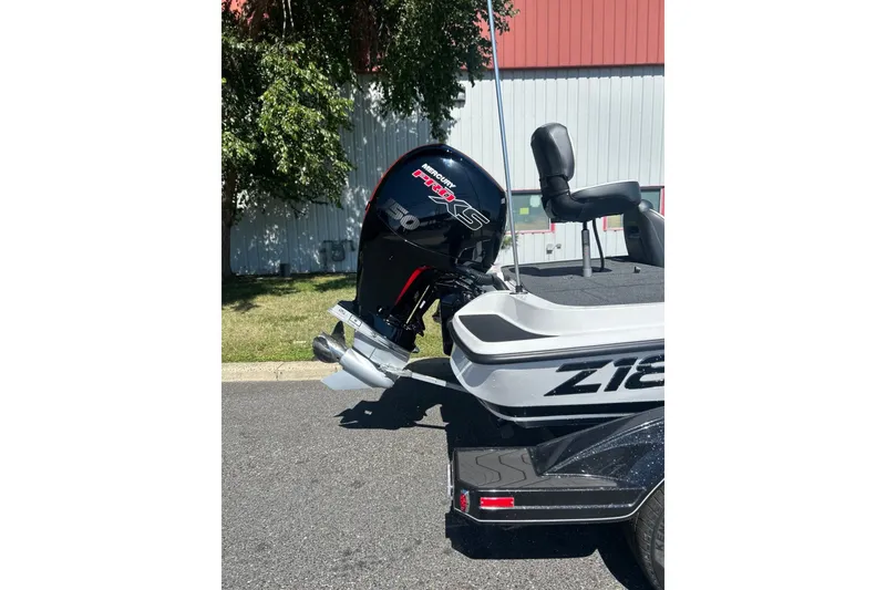 Slide: The Image of 2027 Nitro Z18 XL Pro boat with powerful Mercury engine, parked outdoors. - 9