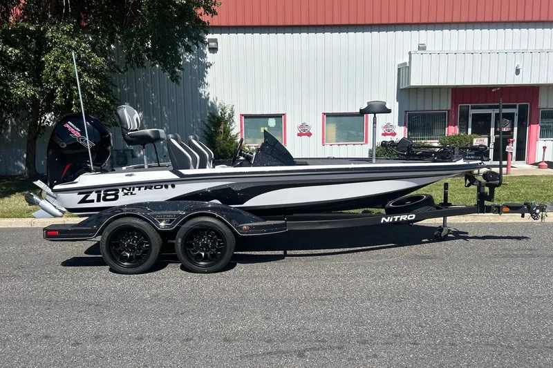 The Image of 2027 Nitro Z18 XL Pro boat on trailer, parked outside a building. - 0
