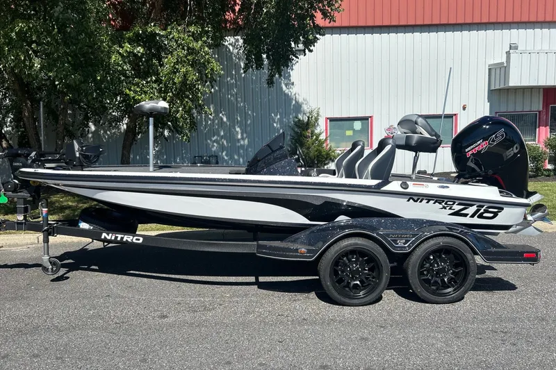 Slide: The Image of 2027 Nitro Z18 XL Pro boat on trailer, parked outdoors. - 2