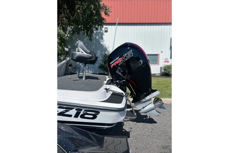 Slide: The Image of 2027 Nitro Z18 XL Pro boat with Mercury Pro XS engine, parked outdoors. - 10