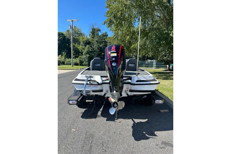 Slide: The Image of 2027 Nitro Z18 XL Pro boat on road, rear view with motor, sunny day. - 6