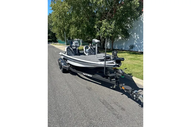Slide: The Image of 2027 Nitro Z18 XL Pro boat on trailer, parked on a sunny street. - 3