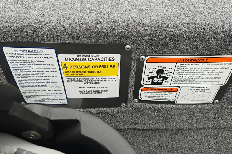 Slide: The Image of Boat safety labels and warnings on a 2027 Tracker Super Guide V-16 SC. - 18