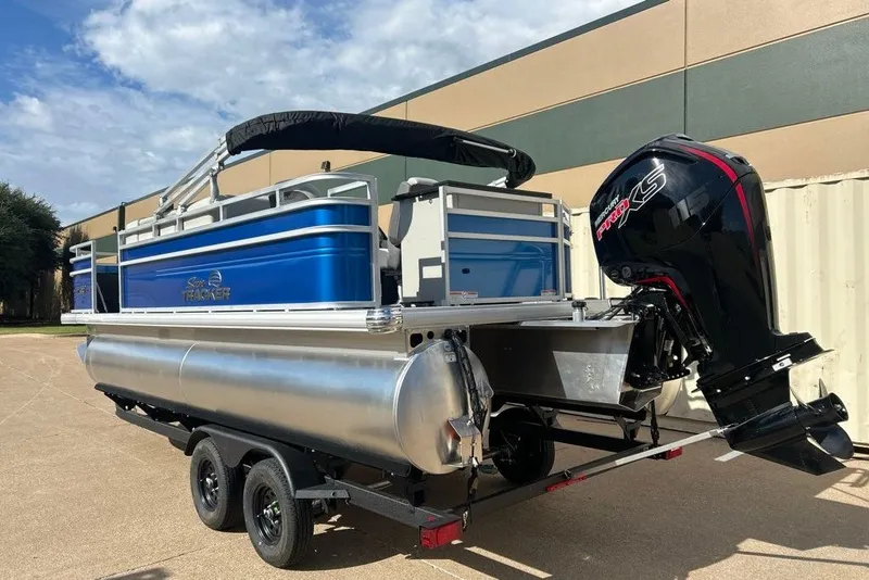 Slide: The Image of 2027 Sun Tracker Fishin' Barge 20 DLX pontoon boat with powerful outboard motor. - 13