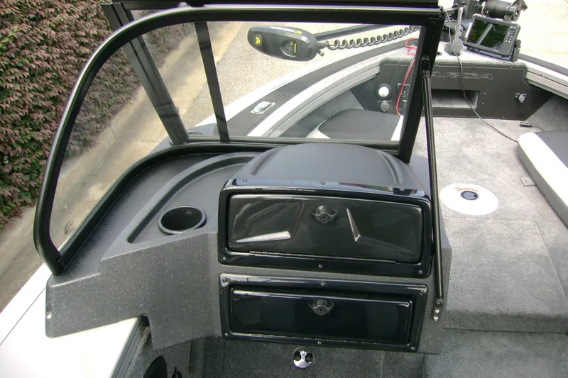 Slide: The Image of 2027 Tracker Targa V-18 Combo boat interior with dashboard and seating area. - 14