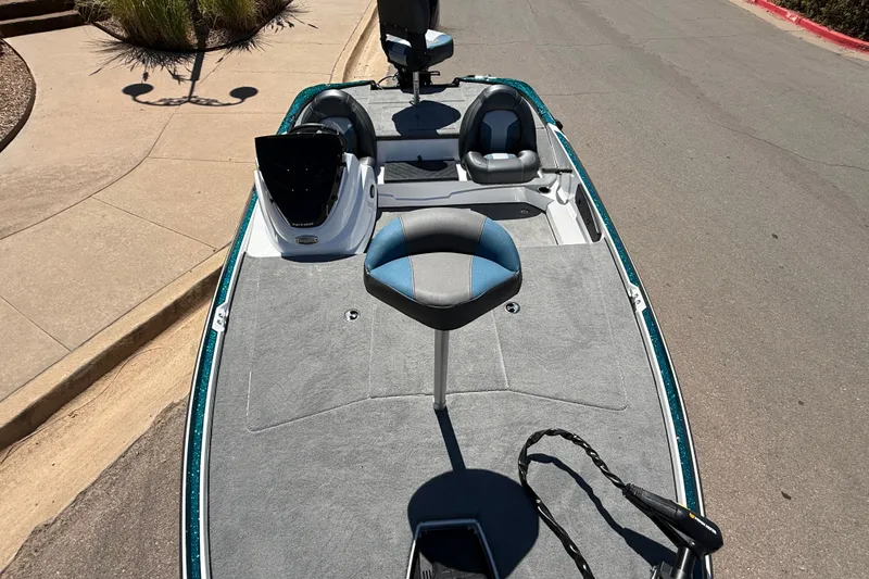 Slide: The Image of 2027 Nitro Z17 fishing boat with seating and control panel on a sunny day. - 5