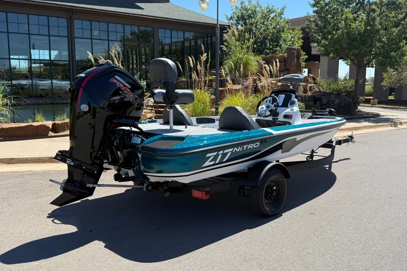 Slide: The Image of 2027 Nitro Z17 boat with Mercury Pro XS engine on trailer, parked outdoors. - 9