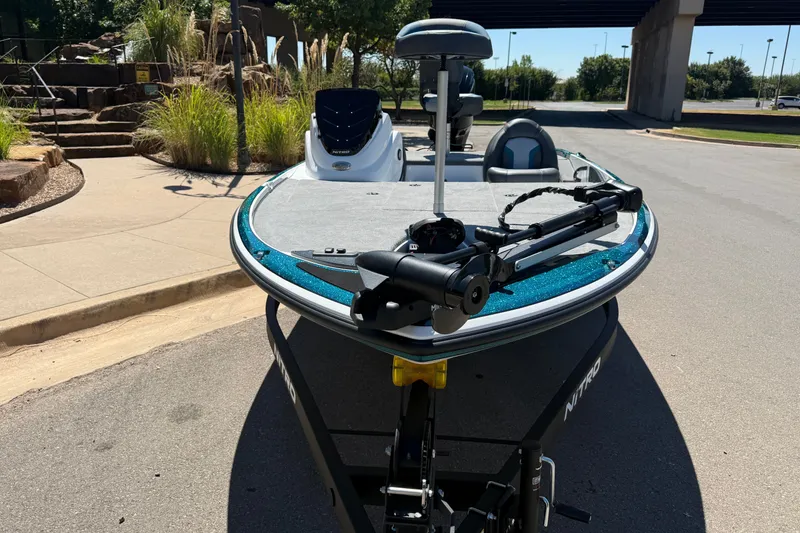 Slide: The Image of 2027 Nitro Z17 boat on trailer, parked outdoors near landscaped area. - 3