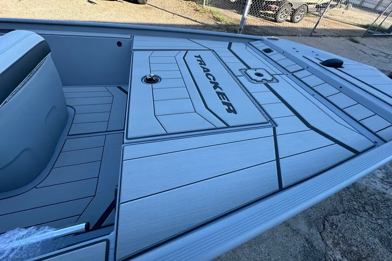 Slide: The Image of 2027 Tracker Bass Tracker Classic CC boat deck with sleek design and branding. - 13