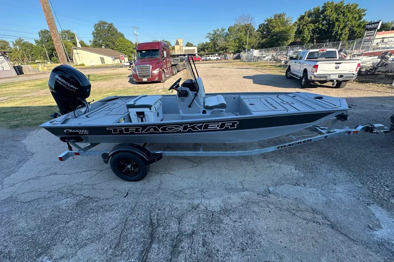 The Image of 2027 Tracker Bass Tracker Classic CC boat on trailer, parked outdoors. - 0