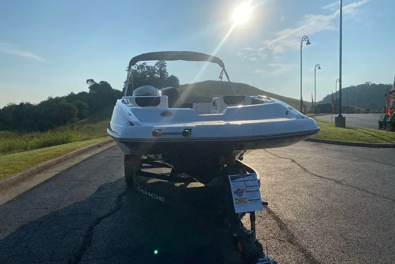 Slide: The Image of 2027 Tahoe 2150 boat on trailer, parked in sunny outdoor setting. - 4