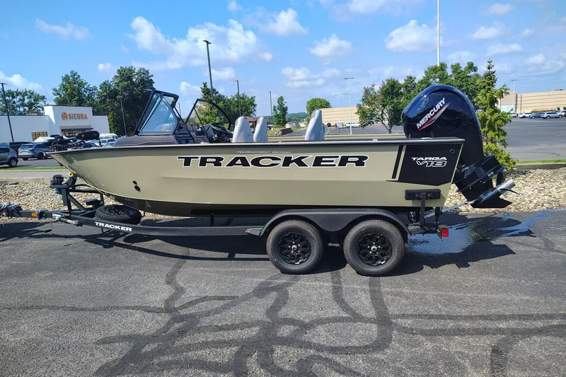 The Image of 2027 Tracker Targa V-18 Combo boat on trailer, parked outdoors under a clear sky. - 0