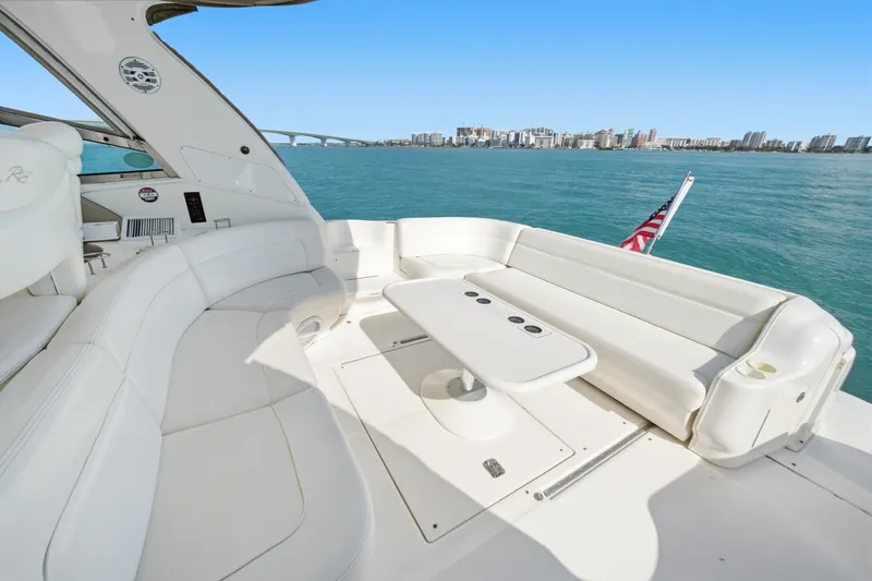 Slide: The Image of Luxurious 2002 Sea Ray Sundancer 460 yacht interior with white seating and ocean view. - 19