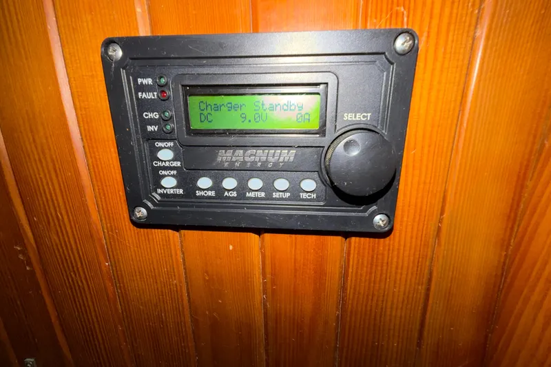Slide: The Image of Control panel on 1983 Tayana Aft Cockpit, displaying charger standby mode at 9.0V. - 19