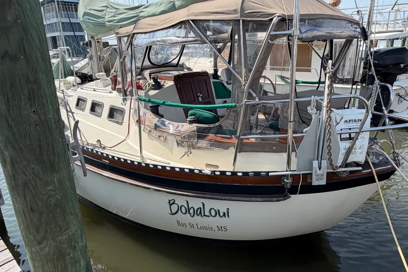 Slide: The Image of 1984 Tayana Aft Cockpit sailboat docked, named "BobaLoui," in Bay St. Louis, MS. - 3