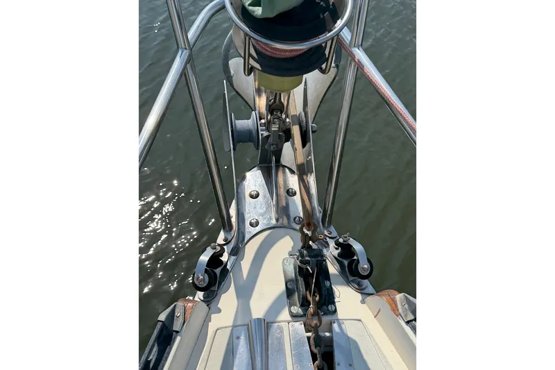 Slide: The Image of Bow view of 1984 Tayana Aft Cockpit sailboat with anchor chain and railing. - 8
