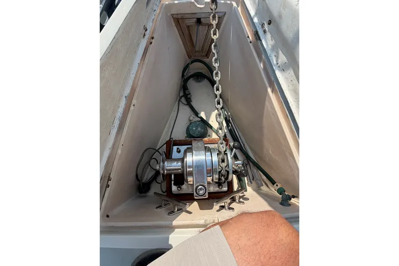 Slide: The Image of Anchor chain and winch on 1984 Tayana Aft Cockpit sailboat deck. - 6