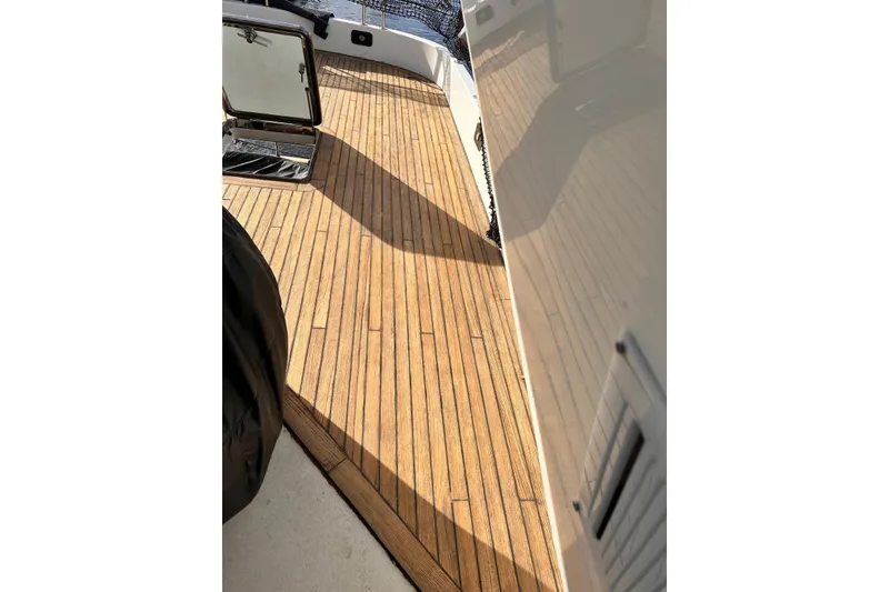 Slide: The Image of Teak deck of 1999 Azimut 85 Ultimate yacht, showcasing elegant wood finish. - 99